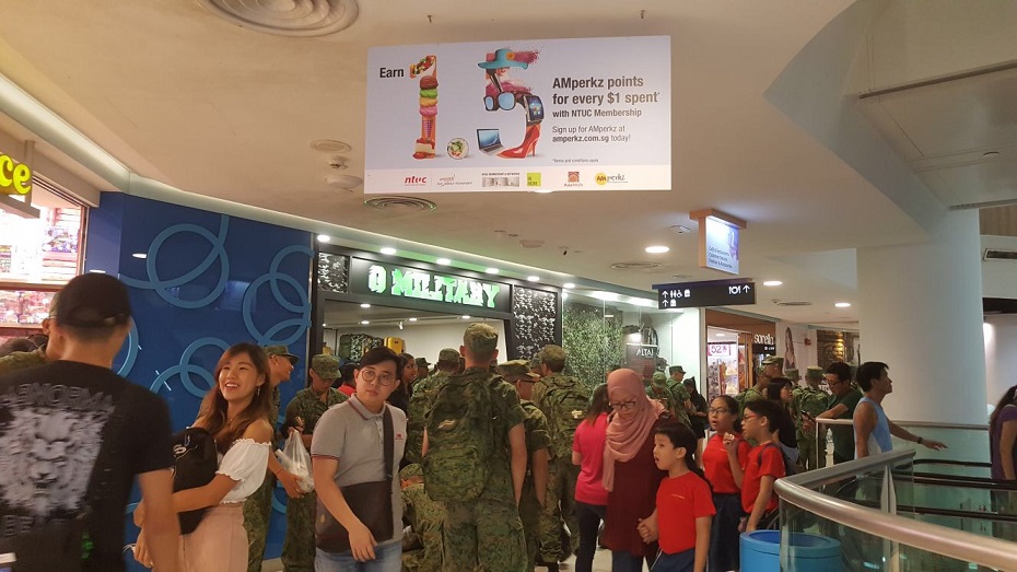 Army boys heading to G Military, a shop at White Sands that sells military and camping goods